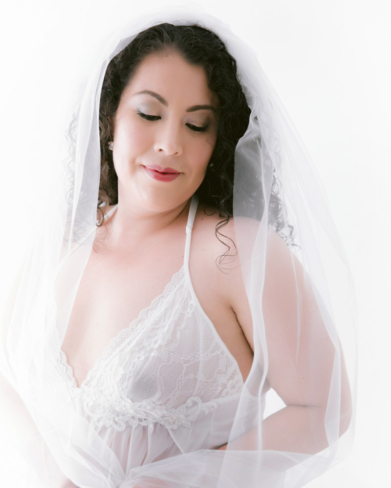 bridal boudoir portrait in white lingerie