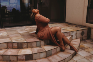 Elegant outdoor portrait capturing a woman's boudoir confidence journey as she embraces strength and inner peace.